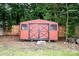 Red storage shed featuring black trim and accents, with a grassy yard at 475 Dot Faris Rd, Catawba, SC 29704