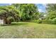 View of a large backyard with green grass and lush landscaping and privacy hedge at 506 7Th Sw St, Hickory, NC 28602