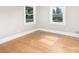 This bedroom is brightly lit with hardwood floors and white trim. Two windows bring the outside in at 506 7Th Sw St, Hickory, NC 28602