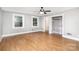 Spacious bedroom features hardwood floors, a ceiling fan, two windows and a closet at 506 7Th Sw St, Hickory, NC 28602