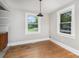 Dining area featuring hardwood floors, large windows, and a pendant light at 506 7Th Sw St, Hickory, NC 28602
