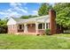 Quaint single-story brick home with a cozy porch and manicured lawn at 506 7Th Sw St, Hickory, NC 28602
