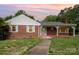 Charming single-story brick home featuring a quaint front porch and well-maintained front yard at 506 7Th Sw St, Hickory, NC 28602