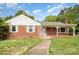 Charming single-story brick home featuring a quaint front porch and well-maintained front yard at 506 7Th Sw St, Hickory, NC 28602