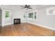 Bright living room with a fireplace, hardwood floors, and large windows at 506 7Th Sw St, Hickory, NC 28602