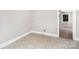 Laundry room with tile flooring and washer/dryer hookups; seamlessly connects to an adjacent room at 506 7Th Sw St, Hickory, NC 28602