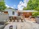 Backyard deck area showcasing a white painted exterior, mature landscaping, and brick accents at 5411 Valley Forge Rd, Charlotte, NC 28210