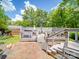 Inviting backyard features a spacious deck with a seating area, perfect for outdoor entertaining and relaxation at 5411 Valley Forge Rd, Charlotte, NC 28210