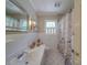 Traditional bathroom with decorative shower curtain, a neutral color palette, and a tiled floor at 5411 Valley Forge Rd, Charlotte, NC 28210
