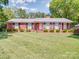 Charming brick ranch-style home with a well-manicured lawn and classic shutters, perfect for curb appeal at 5411 Valley Forge Rd, Charlotte, NC 28210