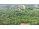 An aerial perspective captures the property's placement within a rich forest with some open, cleared land at 5523 Flint Ridge Church Rd, Marshville, NC 28103