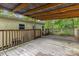Spacious back deck with wooden railings and partial roof coverage, perfect for outdoor relaxation at 5523 Flint Ridge Church Rd, Marshville, NC 28103