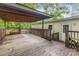 Spacious covered back deck featuring views of the home and surrounding wooded area at 5523 Flint Ridge Church Rd, Marshville, NC 28103