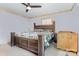 Cozy bedroom with a wooden framed bed and natural light from the windows at 5523 Flint Ridge Church Rd, Marshville, NC 28103
