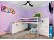 This purple bedroom has a lofted bed, and the room is flooded with natural light at 5523 Flint Ridge Church Rd, Marshville, NC 28103