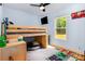 Cozy bedroom with a lofted bed, a desk, and a window that floods the room with natural light at 5523 Flint Ridge Church Rd, Marshville, NC 28103