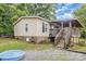 Home exterior with a covered deck, showing the backyard and foundation details at 5523 Flint Ridge Church Rd, Marshville, NC 28103