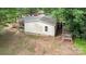 This is an image of the exterior with a small deck, wooden walkway, and surrounded by green trees at 5523 Flint Ridge Church Rd, Marshville, NC 28103