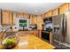 The kitchen features custom wood cabinets, stainless steel appliances, and an eat-in island at 5523 Flint Ridge Church Rd, Marshville, NC 28103