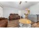 Open living room featuring modern laminate floors, plush leather seating, and access to the kitchen at 5523 Flint Ridge Church Rd, Marshville, NC 28103