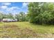 View of property showing a large trailer, green land, and trees at 5523 Flint Ridge Church Rd, Marshville, NC 28103