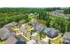 Beautiful aerial view of a lovely neighborhood and pond surrounded by lush trees and manicured lawns at 6136 Sandy Point Ln, Belmont, NC 28012
