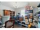 Basement featuring a desk, bookshelves, a rower, and storage shelving at 6136 Sandy Point Ln, Belmont, NC 28012