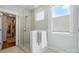 Bathroom boasts a glass-enclosed shower, heated towel rack, and a window for natural light at 6136 Sandy Point Ln, Belmont, NC 28012