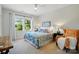 Bedroom featuring a queen bed, large window, ceiling fan, and a sitting chair at 6136 Sandy Point Ln, Belmont, NC 28012