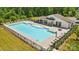 Aerial view of a community pool surrounded by lush greenery, offering a relaxing and inviting space at 6136 Sandy Point Ln, Belmont, NC 28012