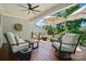 Relaxing deck with comfortable seating, ceiling fan, and overhead lights at 6136 Sandy Point Ln, Belmont, NC 28012
