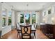 Bright dining room with hardwood floors, large windows and a unique chandelier at 6136 Sandy Point Ln, Belmont, NC 28012