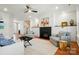 Cozy living room showcasing a fireplace, built-in shelving, and neutral-toned furniture for relaxing comfort at 6136 Sandy Point Ln, Belmont, NC 28012