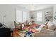 Bright living room with large windows, custom built-ins, and comfortable seating for relaxation and entertaining at 6136 Sandy Point Ln, Belmont, NC 28012