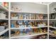 Well-stocked pantry with organized shelving offering ample storage space for food items at 6136 Sandy Point Ln, Belmont, NC 28012
