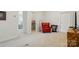 Cozy sitting room featuring neutral carpet and a classic red leather chair at 6136 Sandy Point Ln, Belmont, NC 28012
