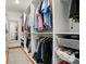 Spacious walk-in closet provides ample storage with custom shelving and organization system at 6136 Sandy Point Ln, Belmont, NC 28012