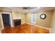 Charming living room featuring hardwood floors and a cozy fireplace at 615 Grier St, Lincolnton, NC 28092