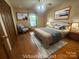 Comfortable bedroom with hardwood floors, picture window, and ample closet space at 6339 River Front Dr, Harrisburg, NC 28075
