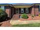 Brick home entrance with covered landing and brick steps at 6339 River Front Dr, Harrisburg, NC 28075