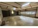 Spacious garage with ample storage cabinets, overhead lighting, and a multi-panel garage door at 6339 River Front Dr, Harrisburg, NC 28075