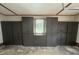 A Garage featuring ample built-in storage cabinets, window, and epoxy flooring at 6339 River Front Dr, Harrisburg, NC 28075