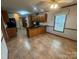 Traditional eat-in kitchen with wood cabinets and granite countertops for a classic, functional design at 6339 River Front Dr, Harrisburg, NC 28075