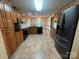 Well-equipped kitchen featuring stainless steel appliances, dark countertops, and plenty of storage at 6339 River Front Dr, Harrisburg, NC 28075
