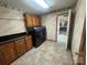 Convenient laundry room with modern washer and dryer, storage cabinets, and exterior access door at 6339 River Front Dr, Harrisburg, NC 28075