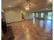 Bright, open living area with tile flooring and a fireplace, perfect for entertaining or relaxing at 6339 River Front Dr, Harrisburg, NC 28075