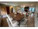 This spacious living room features an adjacent dining area and abundant natural light at 6339 River Front Dr, Harrisburg, NC 28075