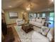 Bright living room with fireplace, neutral tones, and an open floor plan at 6339 River Front Dr, Harrisburg, NC 28075