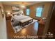 Well-lit main bedroom with ample closet space and hardwood floors at 6339 River Front Dr, Harrisburg, NC 28075