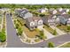 Aerial view of a home with a manicured lawn, landscaping, trees, and long driveway on a beautiful street at 7318 Rupell Dr, Charlotte, NC 28273